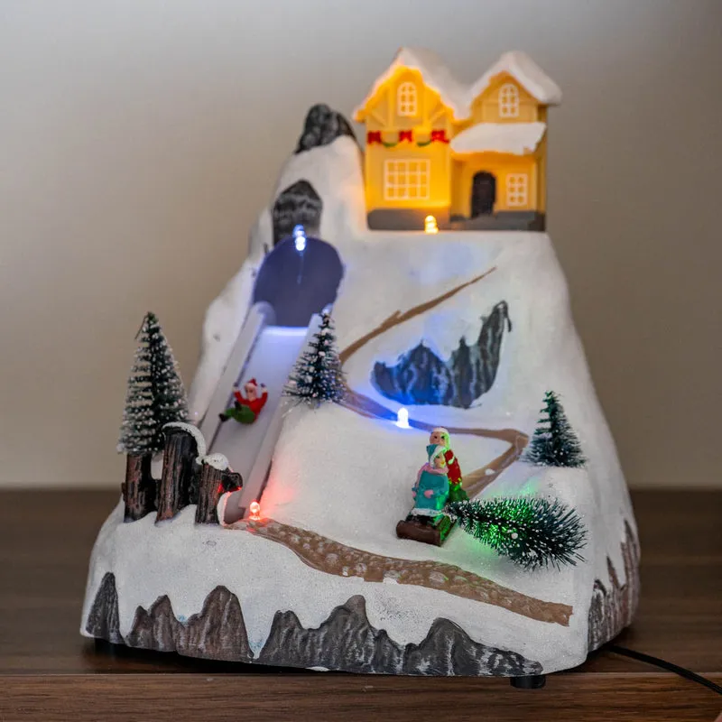 Giostra Natalizia con Scivolo e Casa Illuminata Villaggio di Natale Il Gruppone