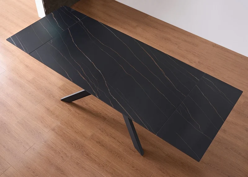 Tavolo "Pollux" con gambe in ferro e piano in pietra sinterizzata 160/240 x 110 x h 75 cm