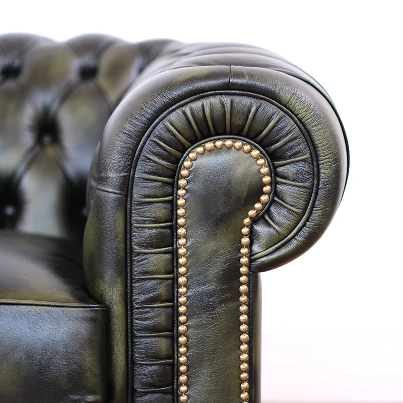 Divano Chesterfield pelle fiore verde stile old America rifinita a mano
