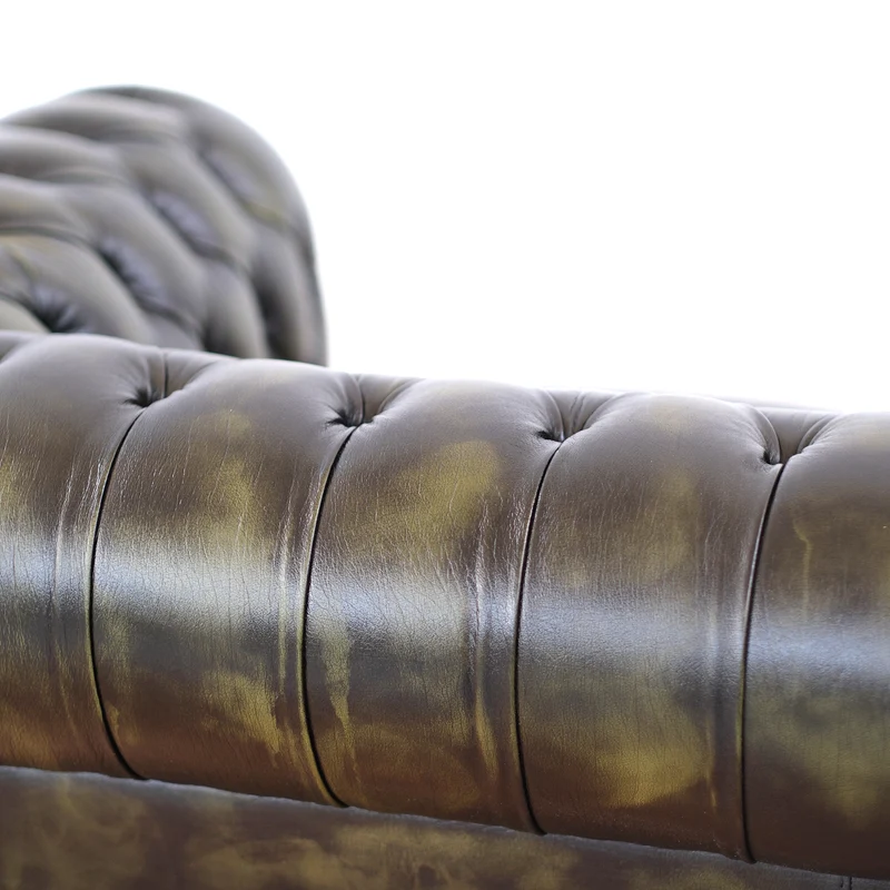Divano Chesterfield pelle fiore verde stile old America rifinita a mano