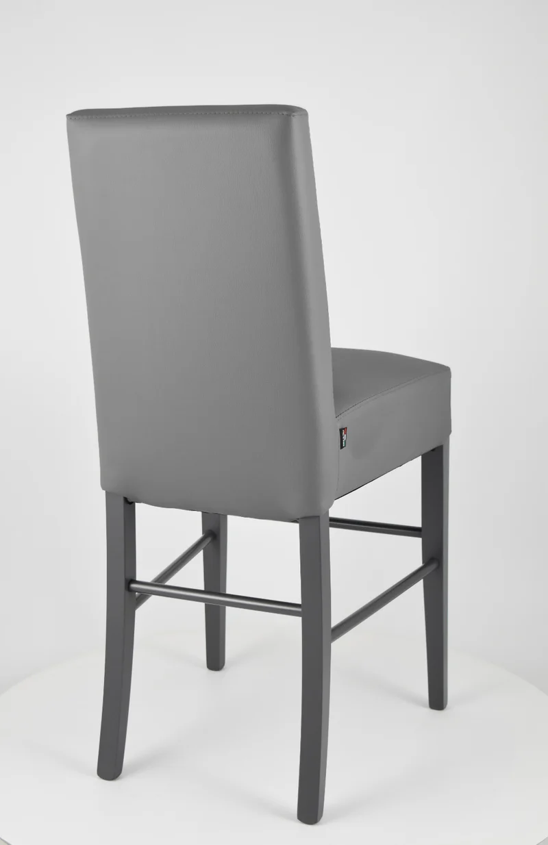 Sgabello basso modello Luisa con struttura in legno di faggio, seduta e schienale imbottiti e rivestiti in pelle artificiale + colori