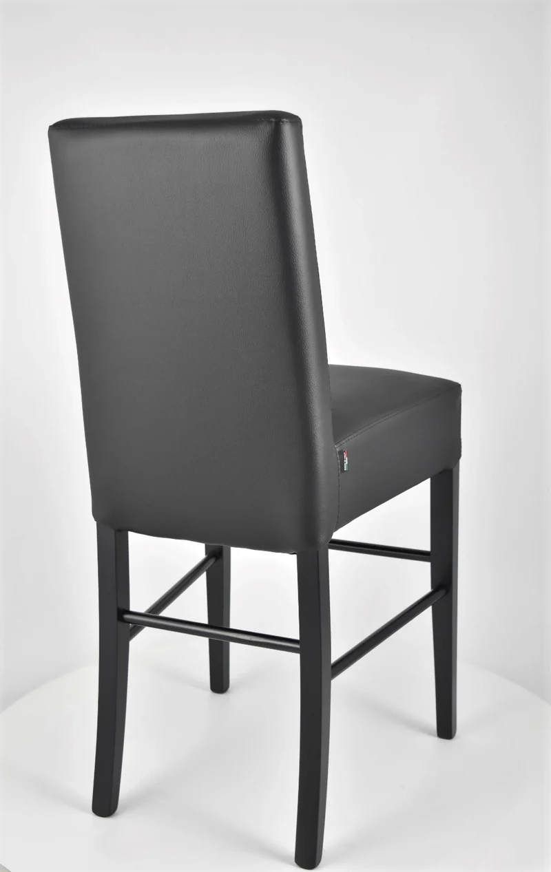 Sgabello basso modello Luisa con struttura in legno di faggio, seduta e schienale imbottiti e rivestiti in pelle artificiale + colori