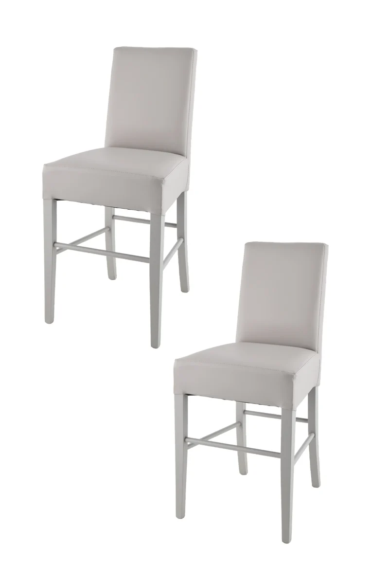 Sgabello basso modello Luisa con struttura in legno di faggio, seduta e schienale imbottiti e rivestiti in pelle artificiale + colori