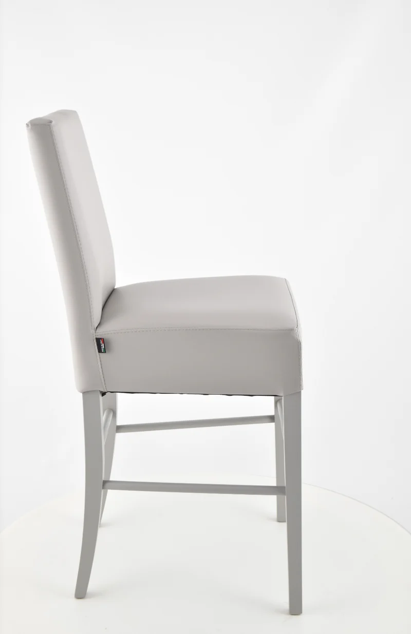 Sgabello basso modello Luisa con struttura in legno di faggio, seduta e schienale imbottiti e rivestiti in pelle artificiale + colori
