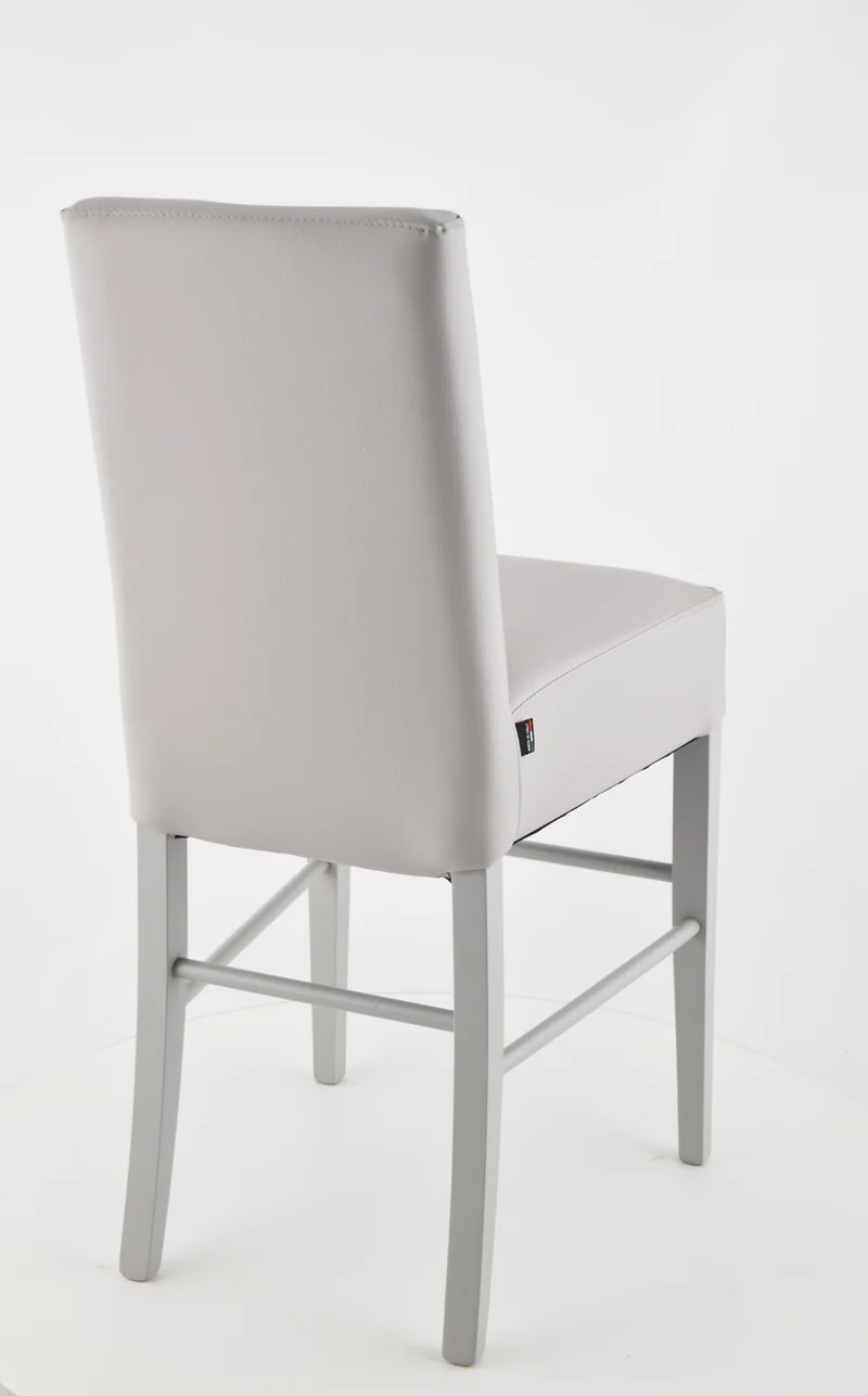 Sgabello basso modello Luisa con struttura in legno di faggio, seduta e schienale imbottiti e rivestiti in pelle artificiale + colori